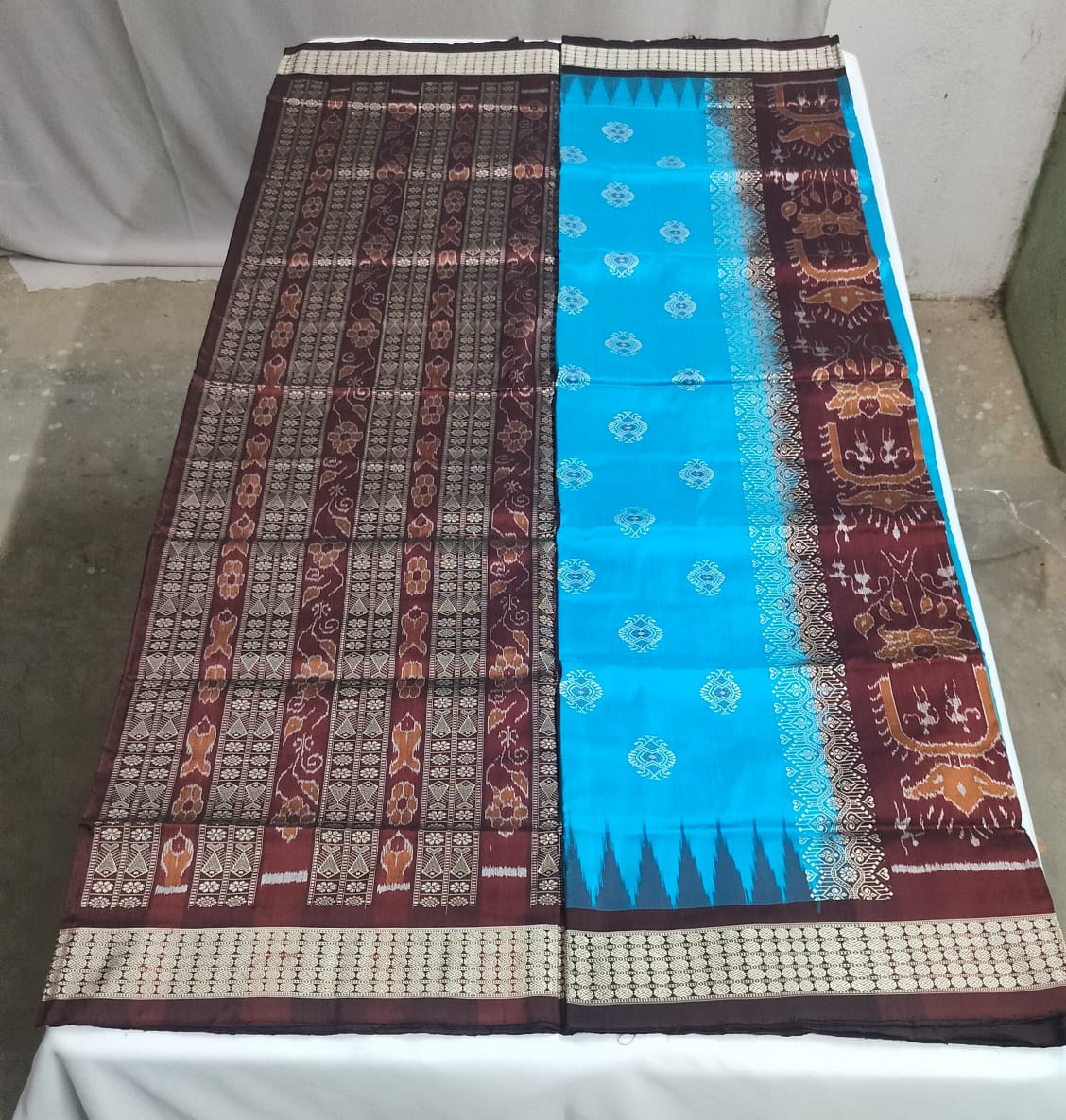 Rich maroon body with golden-beige motifs and borders