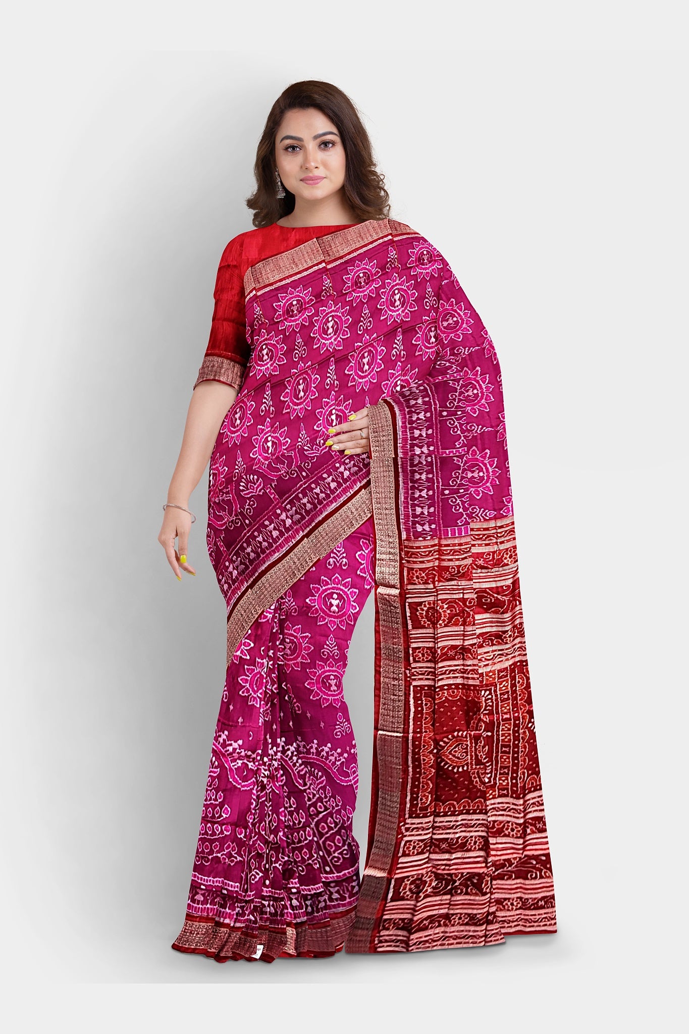A pink and red saree featuring a terracotta tree design with floral motifs on the body, floral pallu, and dip-dyed border.