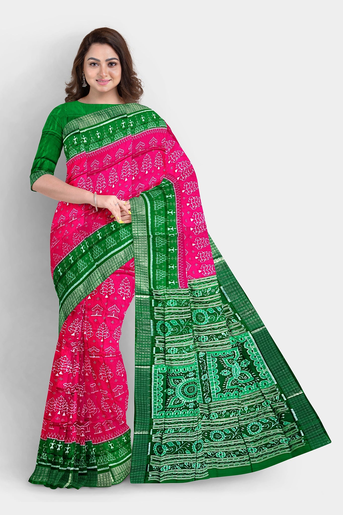 A stunning pink and green pure pata saree featuring tree and house motifs, a terracotta-inspired pallu with flowers, and intricate **muruja** designs.