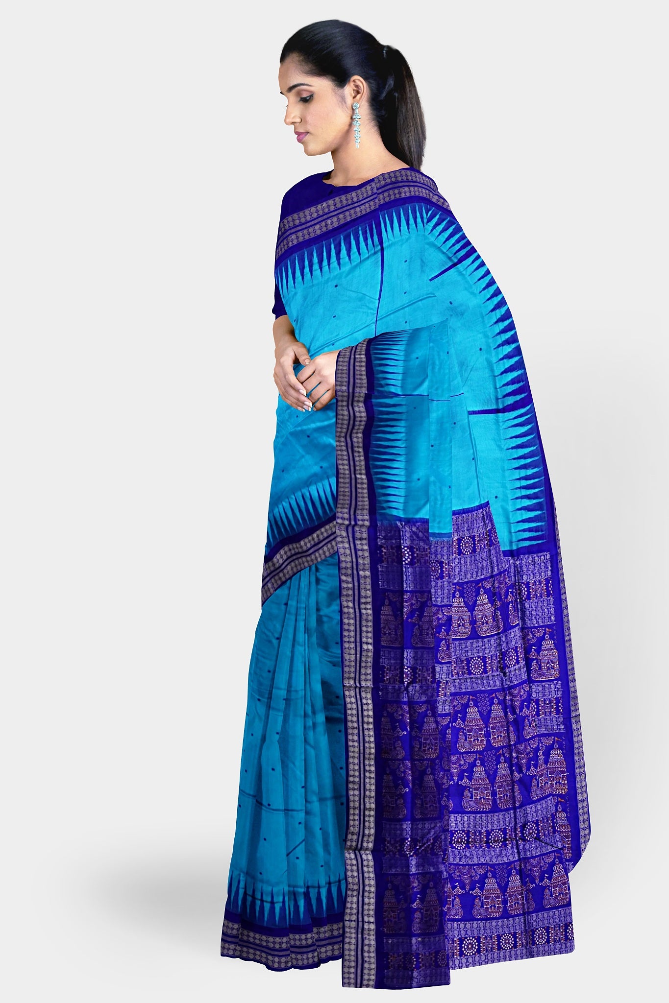 A beautiful sky and blue mix pata saree with plain body pattern and a temple design on the pallu.