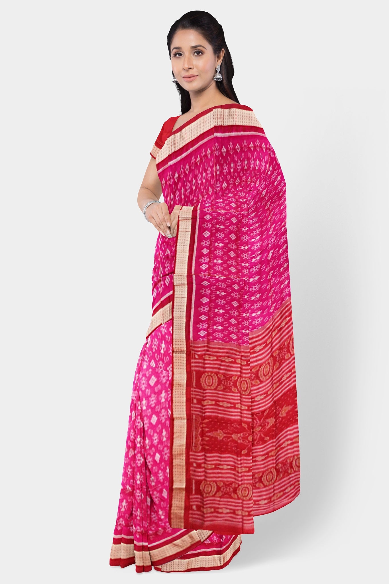 Pink and red Sambalpuri pata saree features a body with delicate little man and flower motifs, complemented by a Pasapali design. The pallu showcases intricate floral patterns.