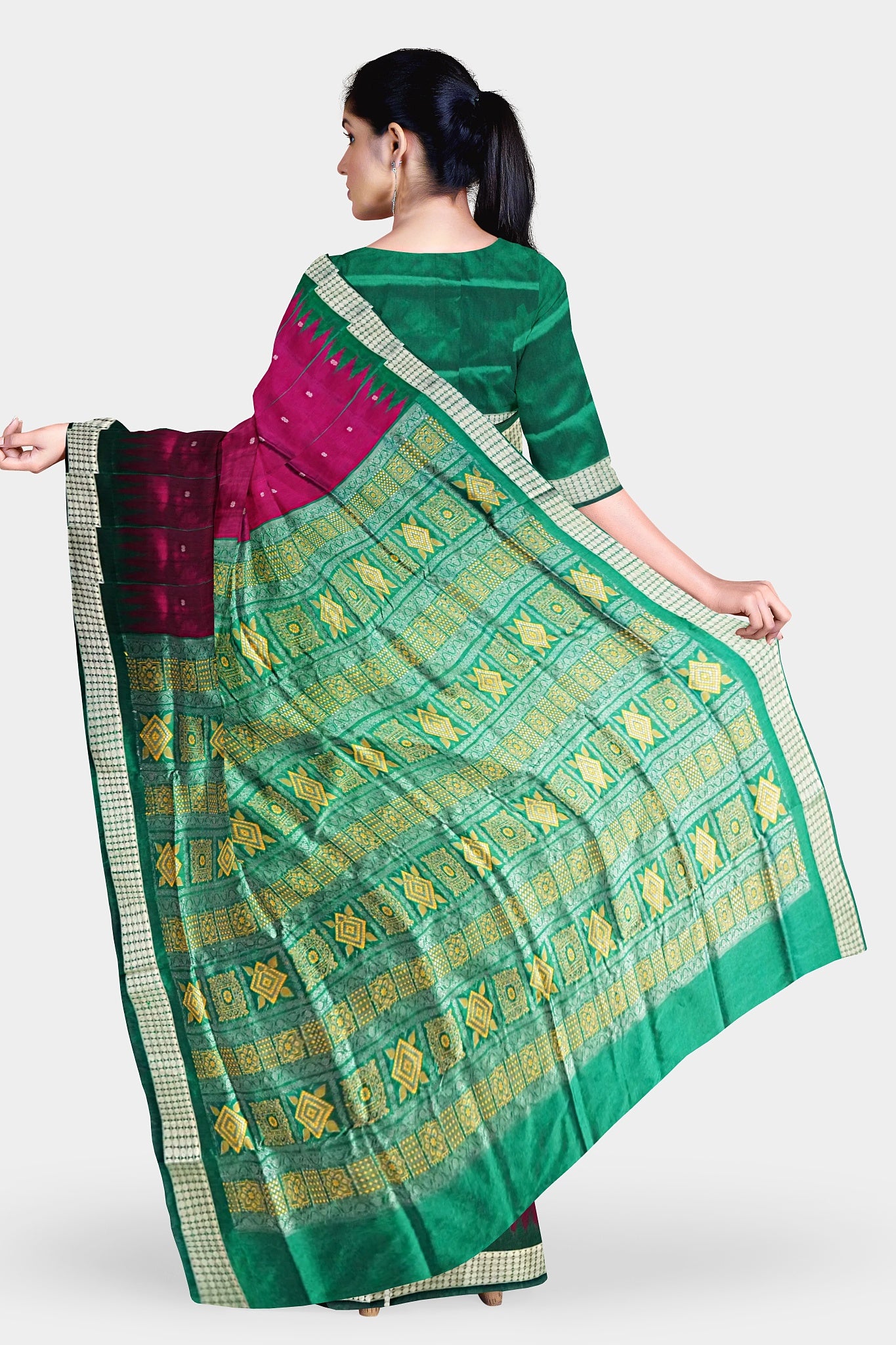 Dark pink and green mix pata saree with butta pattern on the body, and pallu featuring Bomkei and Sonepuri design. Elegant and traditional.