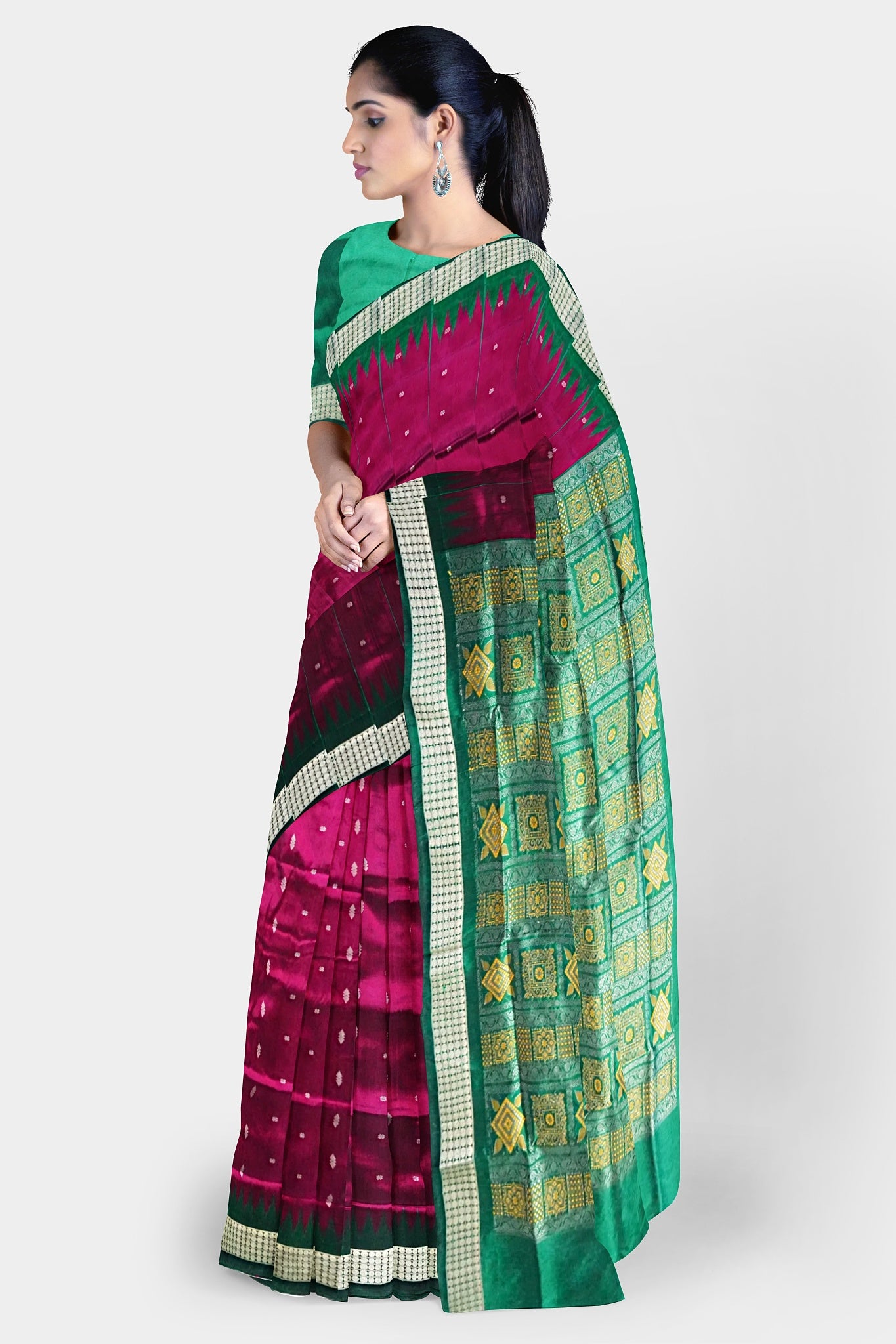 Dark pink and green mix pata saree with butta pattern on the body, and pallu featuring Bomkei and Sonepuri design. Elegant and traditional.