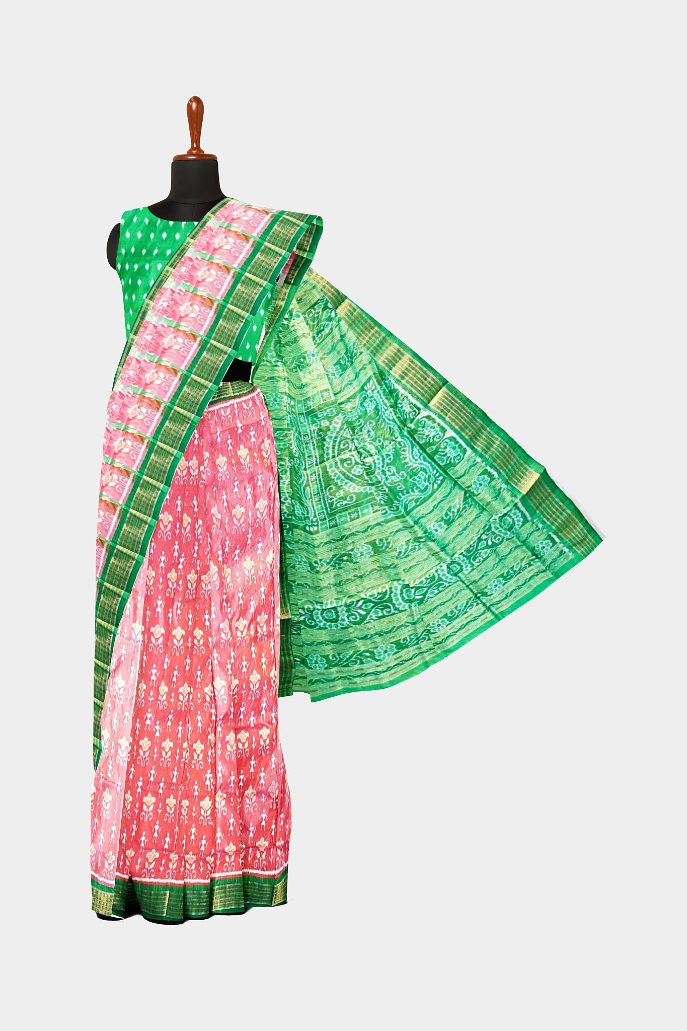 Elegant pink and green pure pata saree with small man motifs on the body and large round floral designs on the pallu.