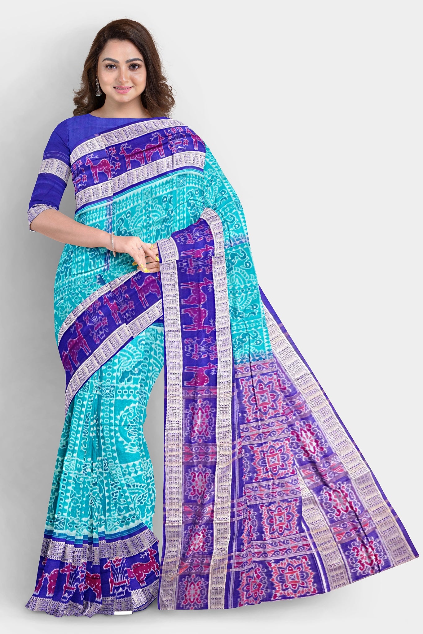 The blue and sky-colored Sambalpuri saree features intricate ikat patterns on the body, with a pallu adorned with beautiful flower designs.