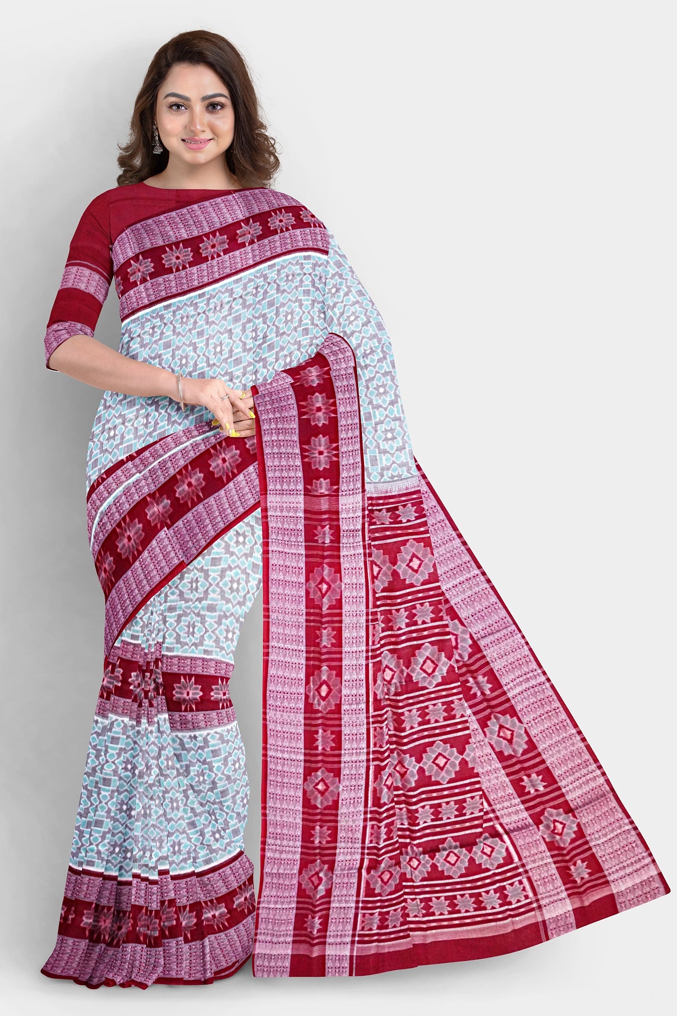 Cyan and maroon Sambalpuri cotton saree features round flower motifs on the body with a pallu adorned in intricate floral designs.