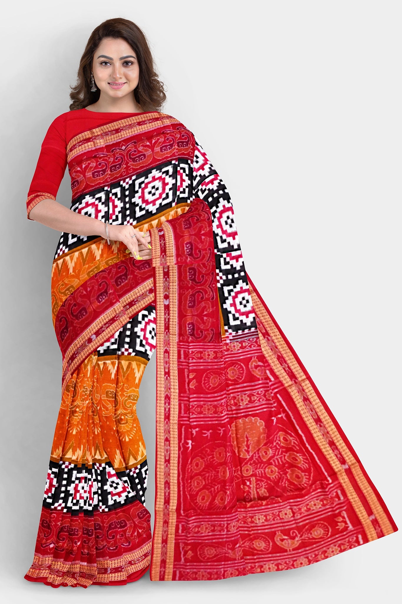The red, black, and yellow Sambalpuri cotton saree features a duck motif, Pasapali chessboard-like border, and peacock design on the pallu.
