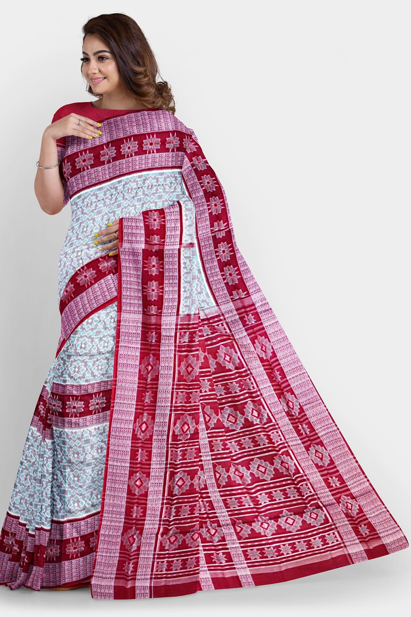 Cyan and maroon Sambalpuri cotton saree features round flower motifs on the body with a pallu adorned in intricate floral designs.