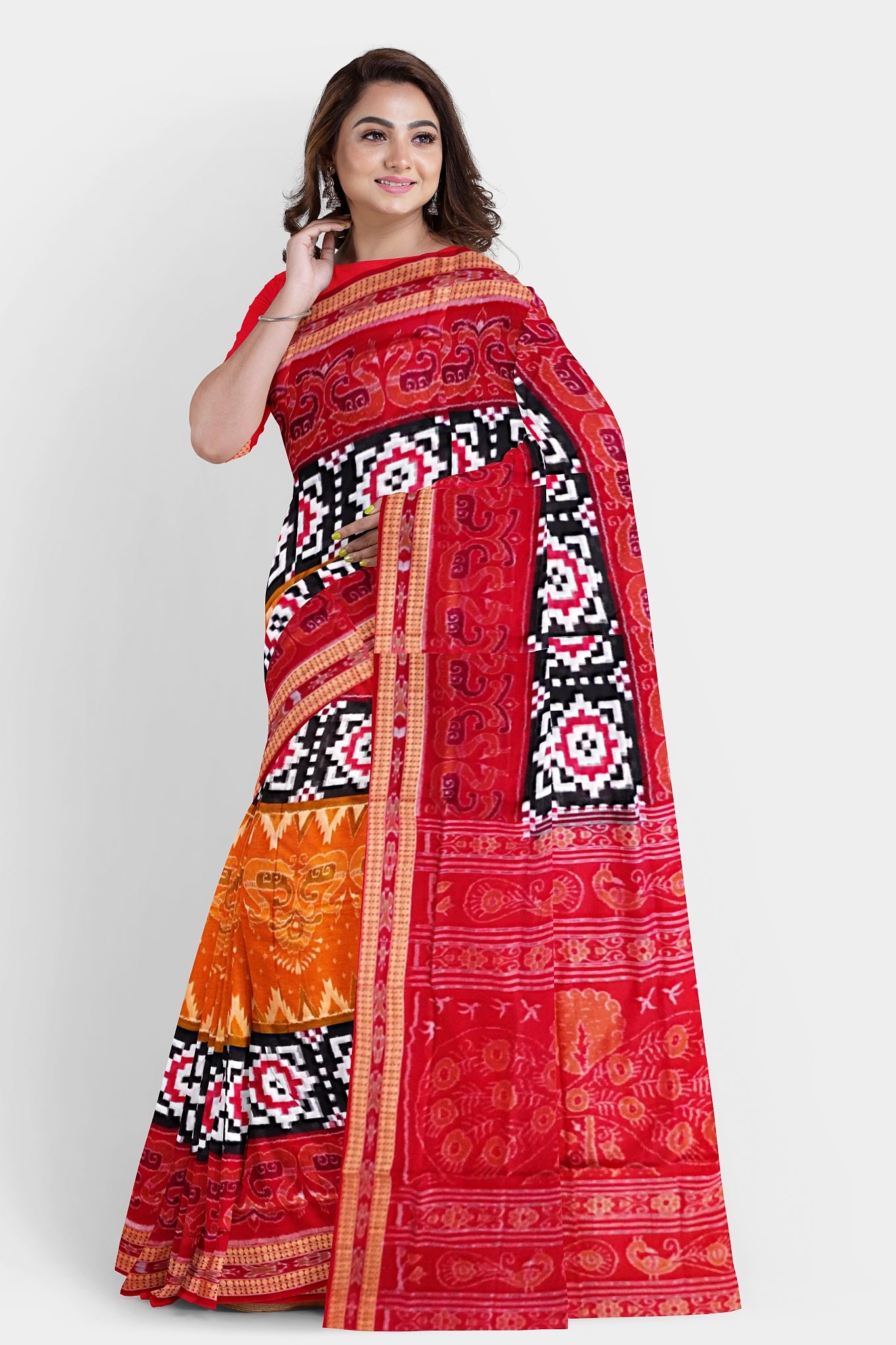 The red, black, and yellow Sambalpuri cotton saree features a duck motif, Pasapali chessboard-like border, and peacock design on the pallu.