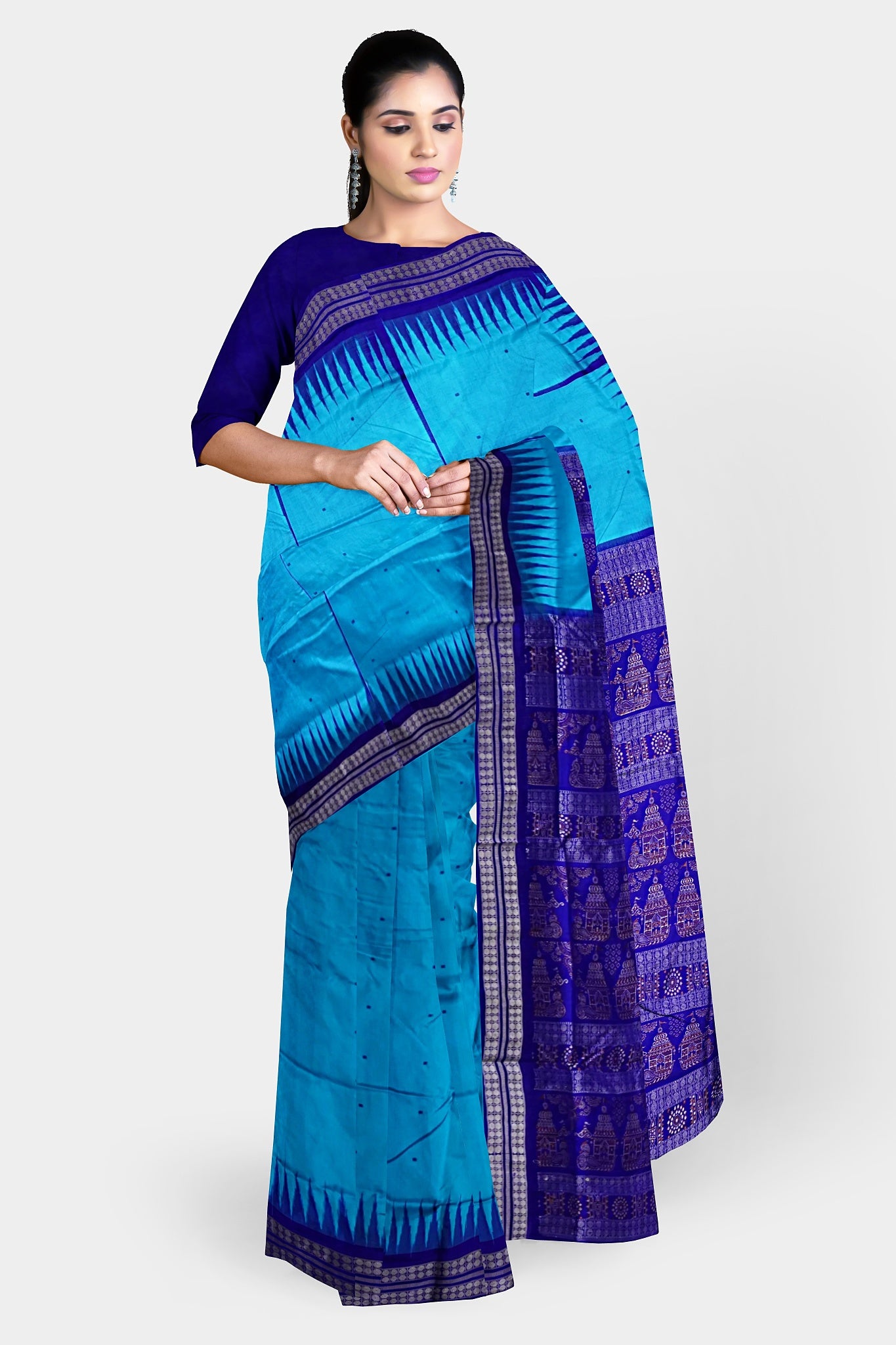 A beautiful sky and blue mix pata saree with plain body pattern and a temple design on the pallu.
