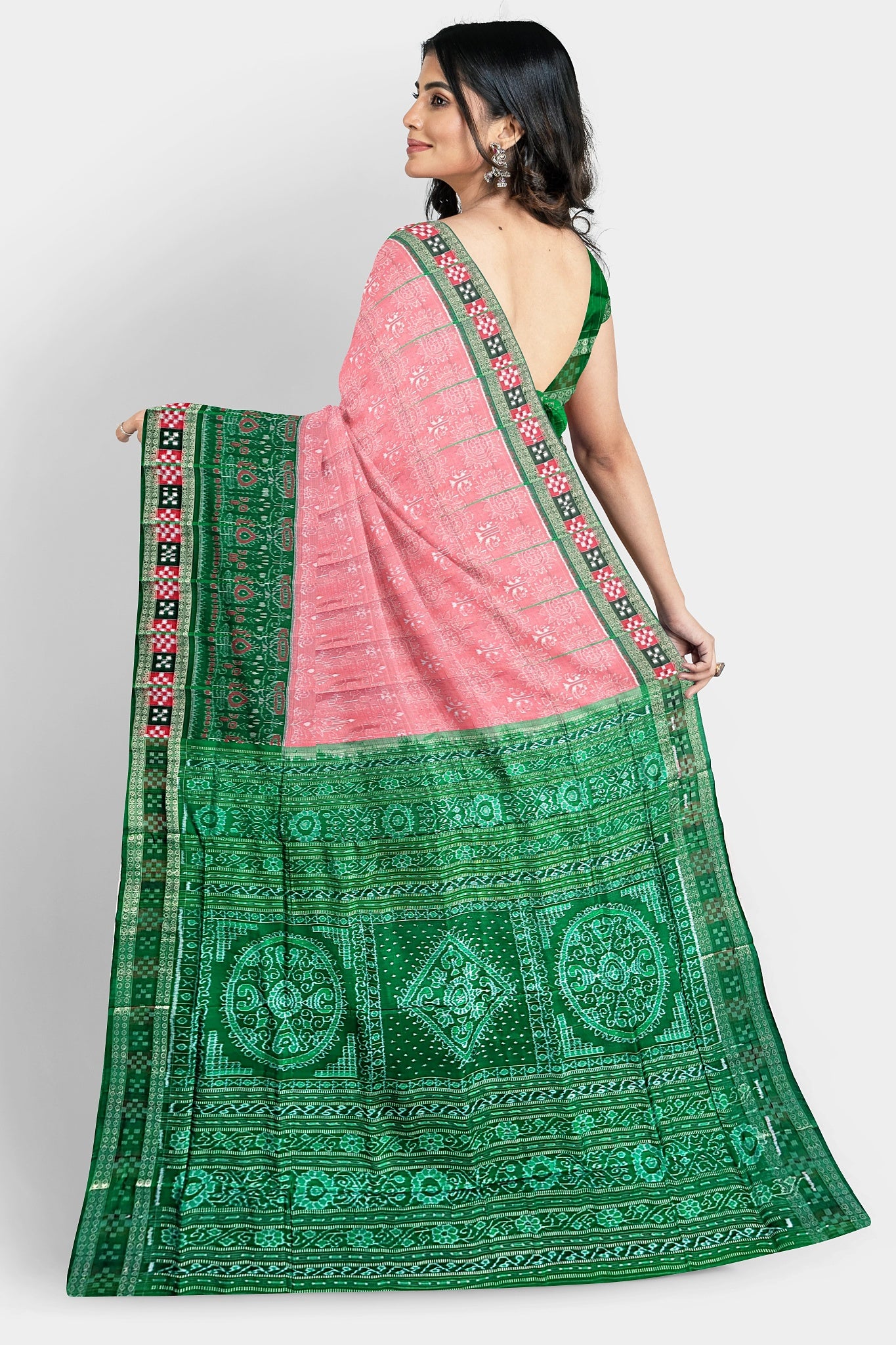 Pink and green pure Pata saree with jabardast floral body pattern and green pallu with three flowers.