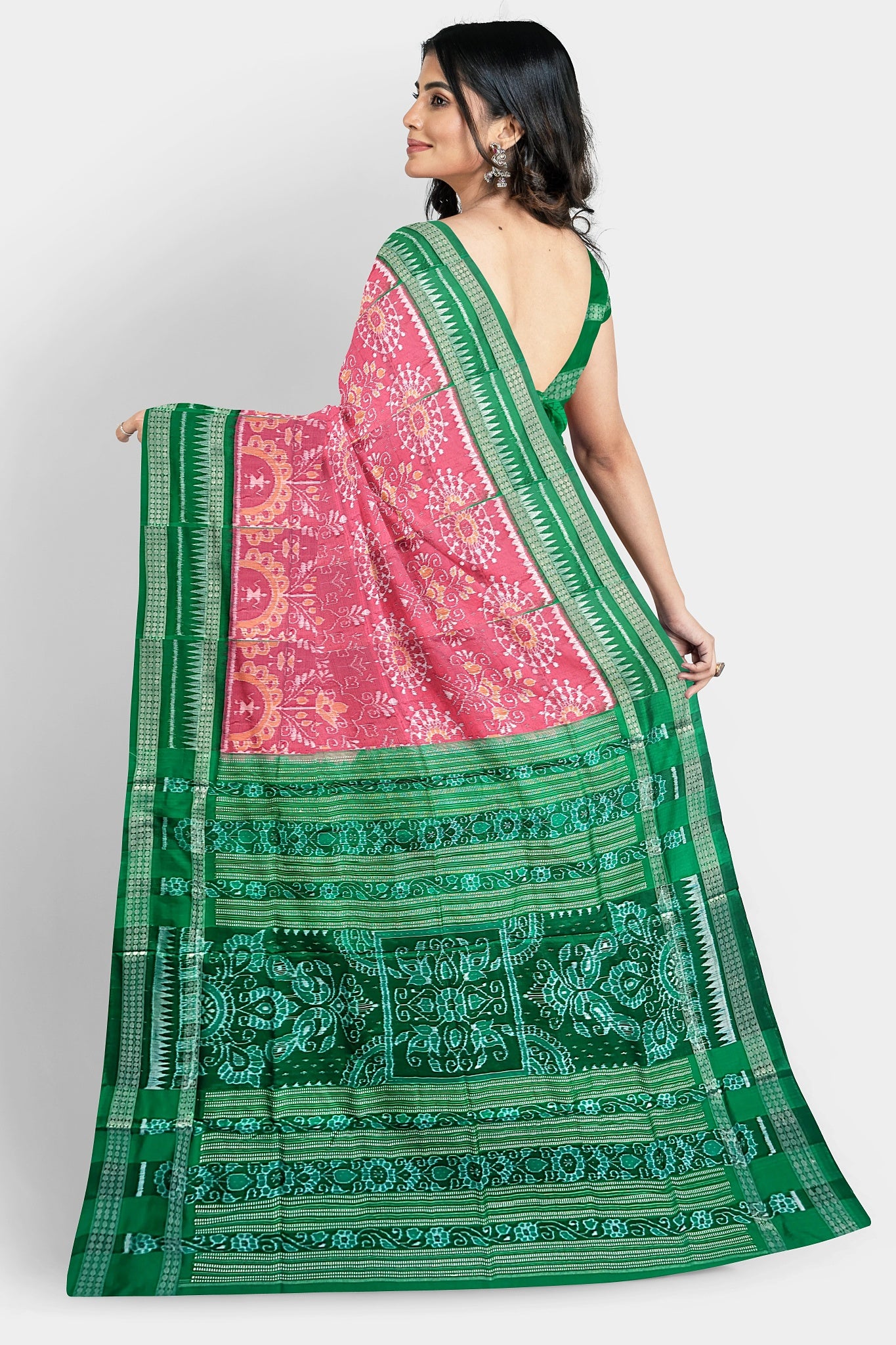 Pink and red pure Pata saree with vibrant floral body and green pallu featuring three big flowers.