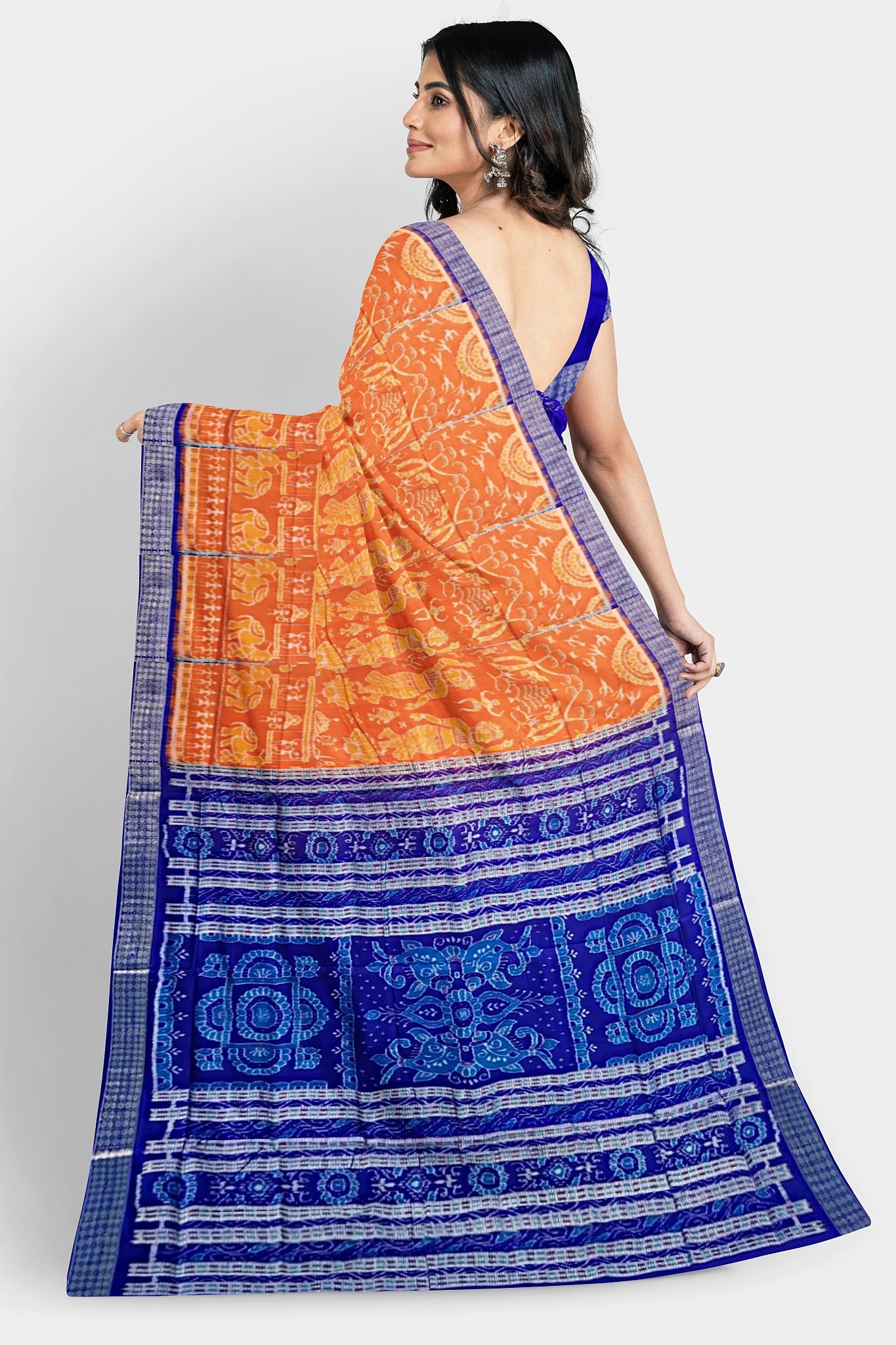 A yellow and blue pure Pata saree with a Nartaki body pattern, temple, elephant, palm tree motifs, and blue fish pallu design.