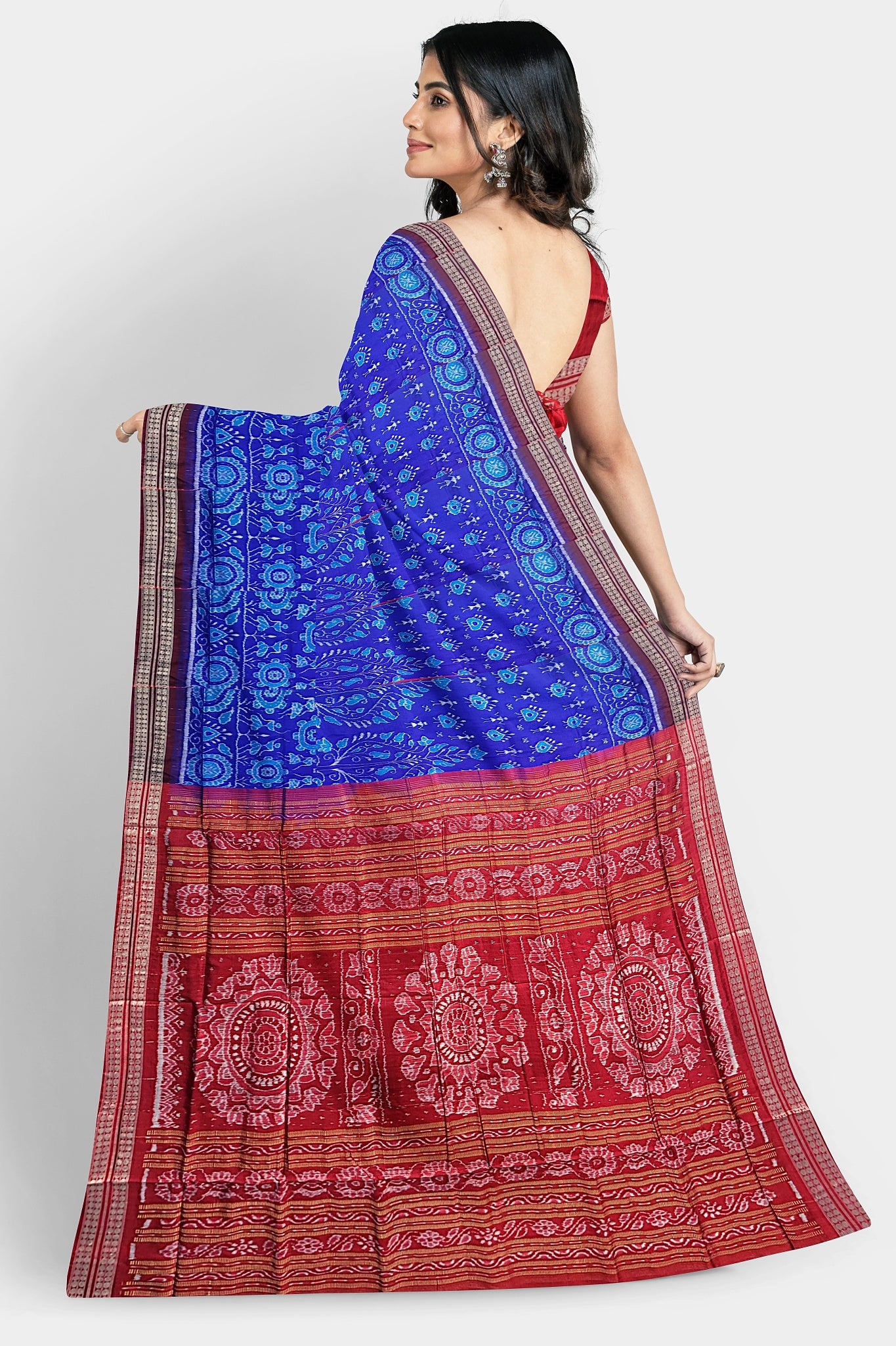 A blue and red pure Pata saree with small tree body pattern, terracotta designs, and pallu featuring three round flowers or vines.