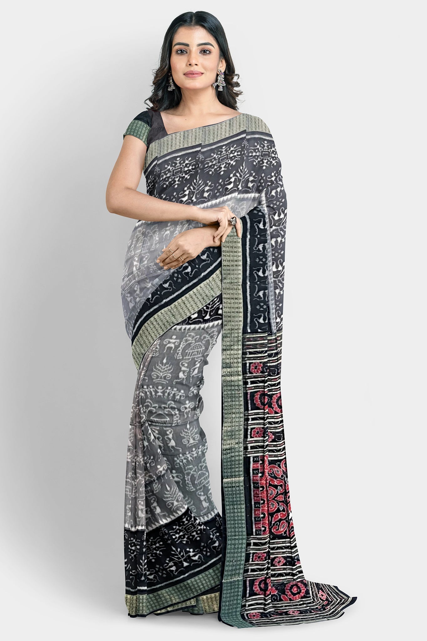A pure shining Pata saree with a 5-inch black and light terracotta body pattern. The red pallu features three big flowers and vines.