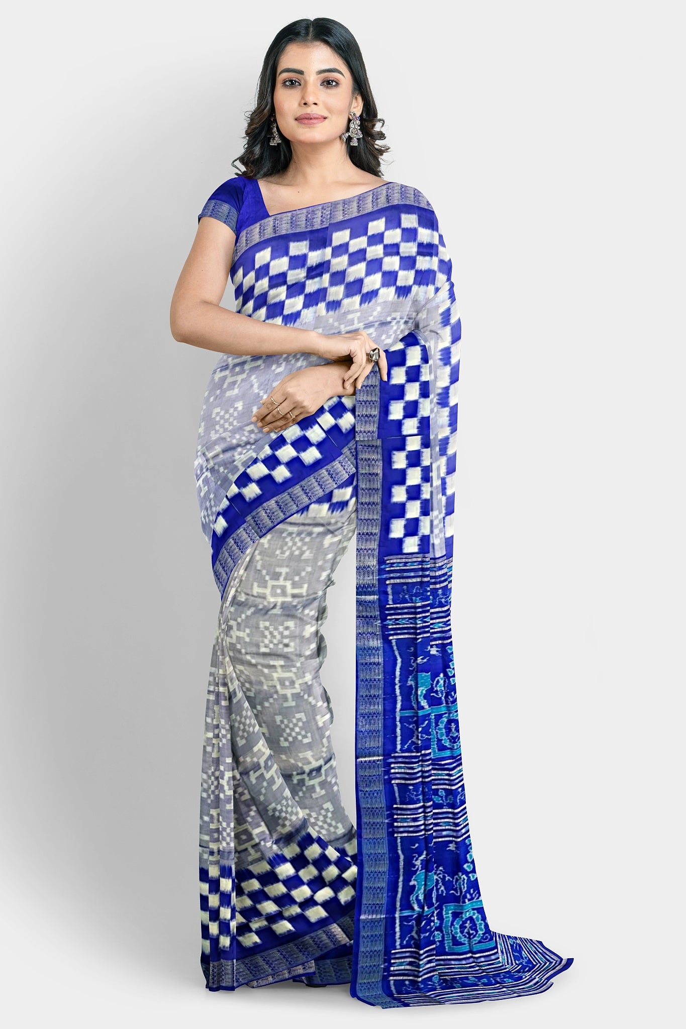A white and blue pure Pata saree with a plain body, Pasapli border, and pallu featuring blue terracotta, house, beer, tree, cat, and duck designs.