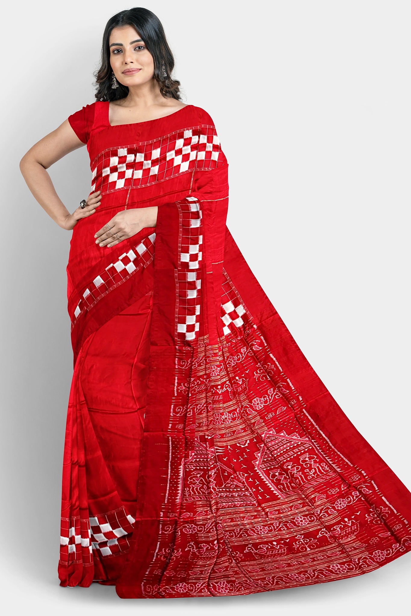 A red silk saree with a plain body, Passapli border, and a famous Boita design pallu featuring Adivasi patterns.