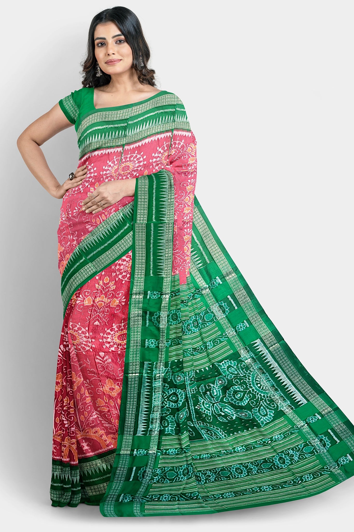 Pink and red pure Pata saree with vibrant floral body and green pallu featuring three big flowers.