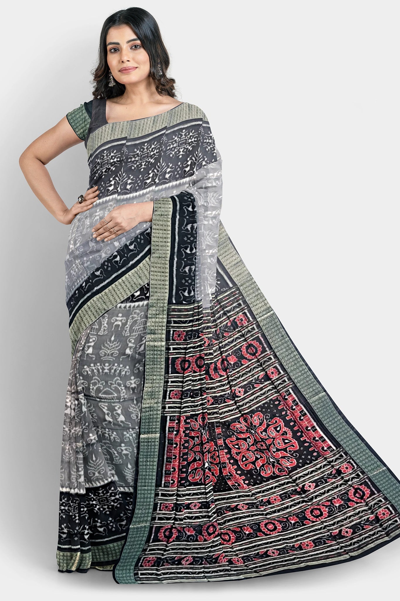 A pure shining Pata saree with a 5-inch black and light terracotta body pattern. The red pallu features three big flowers and vines.