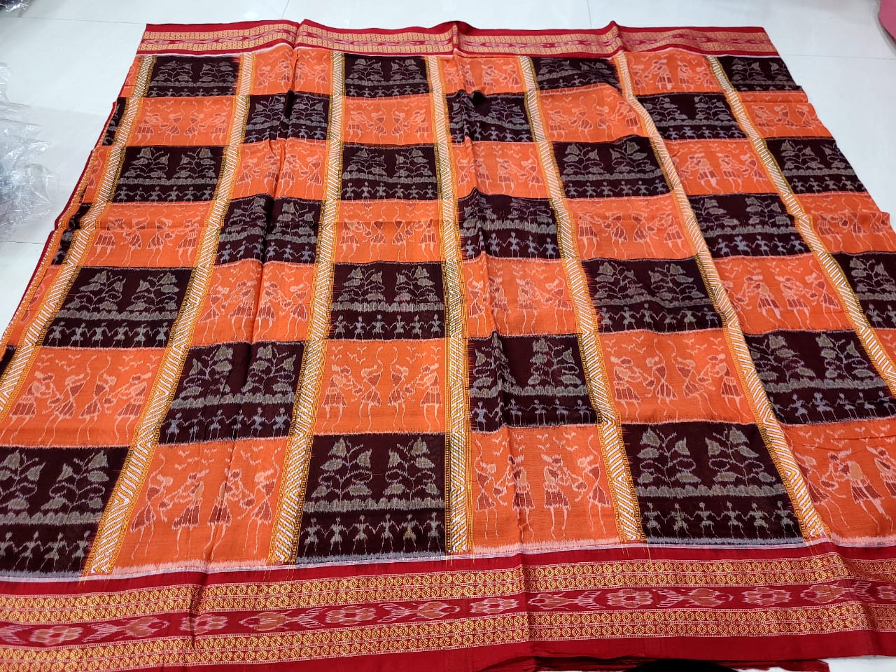 Orange, coffee, and red Sambalpuri cotton saree featuring traditional terracotta pattern, with a bandha pattern on the pallu. - Koshali Arts & Crafts Enterprise