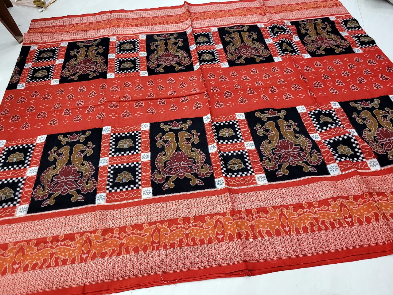 Latest Sambalpuri cotton saree features traditional pasapali with parrot design in vermilion and black, adorned with beautiful flower pallu. - Koshali Arts & Crafts Enterprise