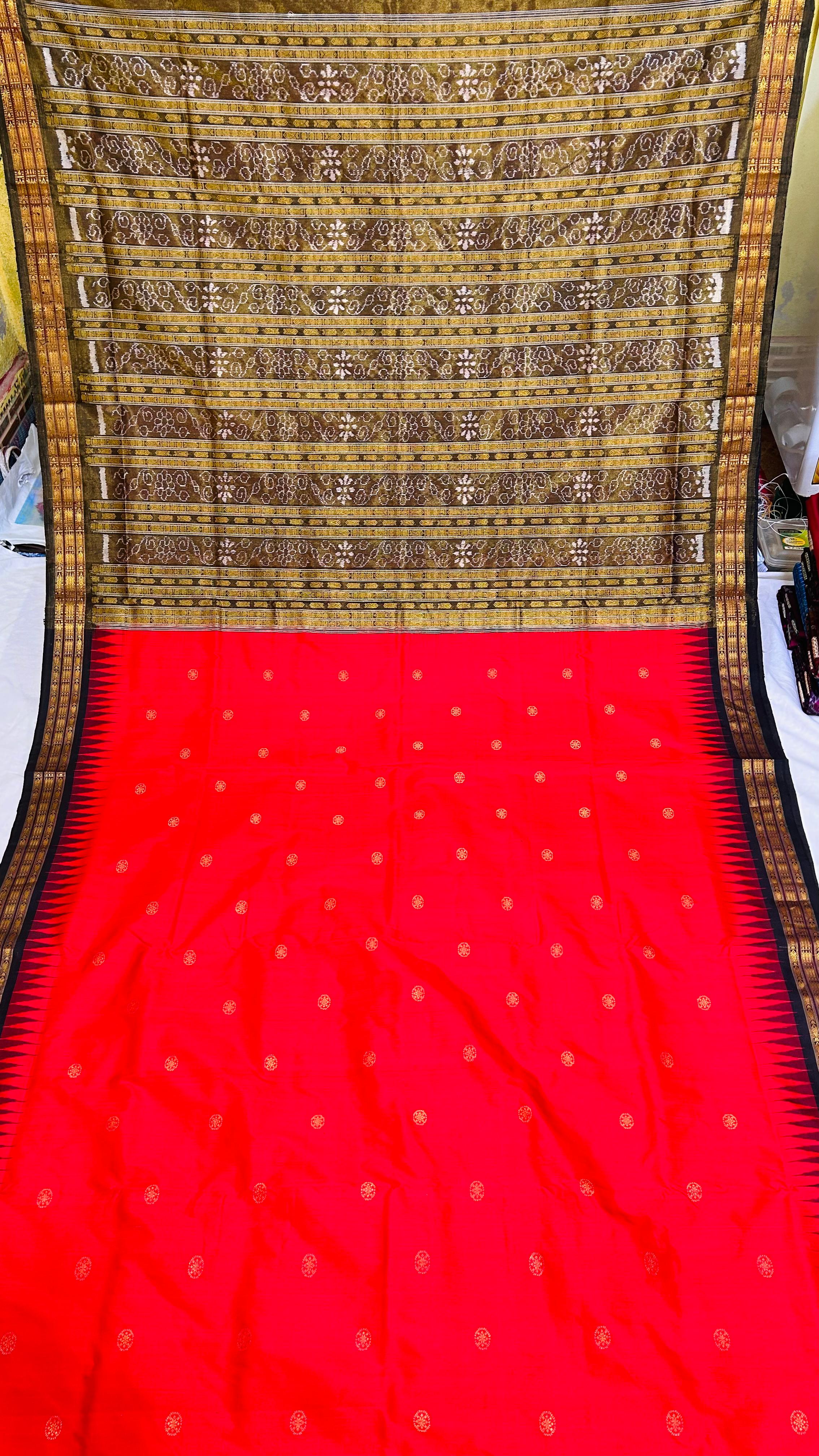 "Handwoven Red and Black Sambalpuri Half tissue silk saree with bandha pallu, complemented by a matching blouse piece. Elegant and traditional." - Koshali Arts & Crafts Enterprise
