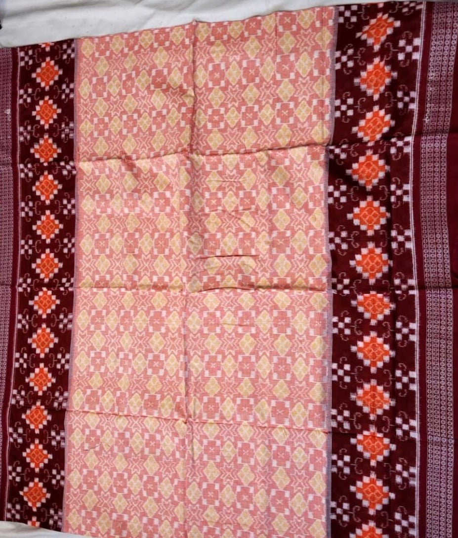A Sambalpuri cotton saree with a vibrant mix of red, yellow, and gray features a striking pasali design on the body, complemented by an exclusive, intricate pallu pattern.
