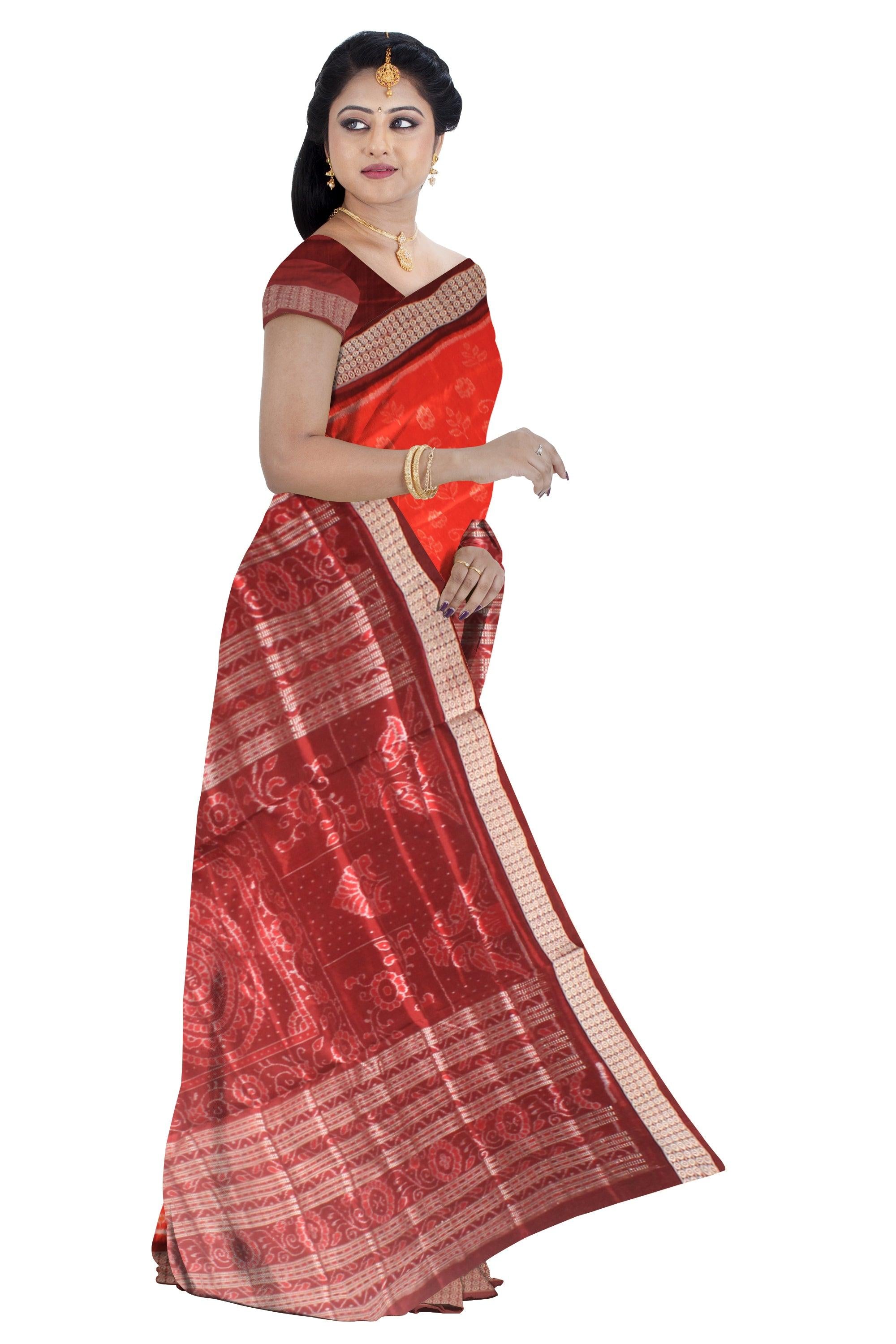 A Sambalpuri pata saree in orange color base in body flower motifs,with blouse piece. - Koshali Arts & Crafts Enterprise