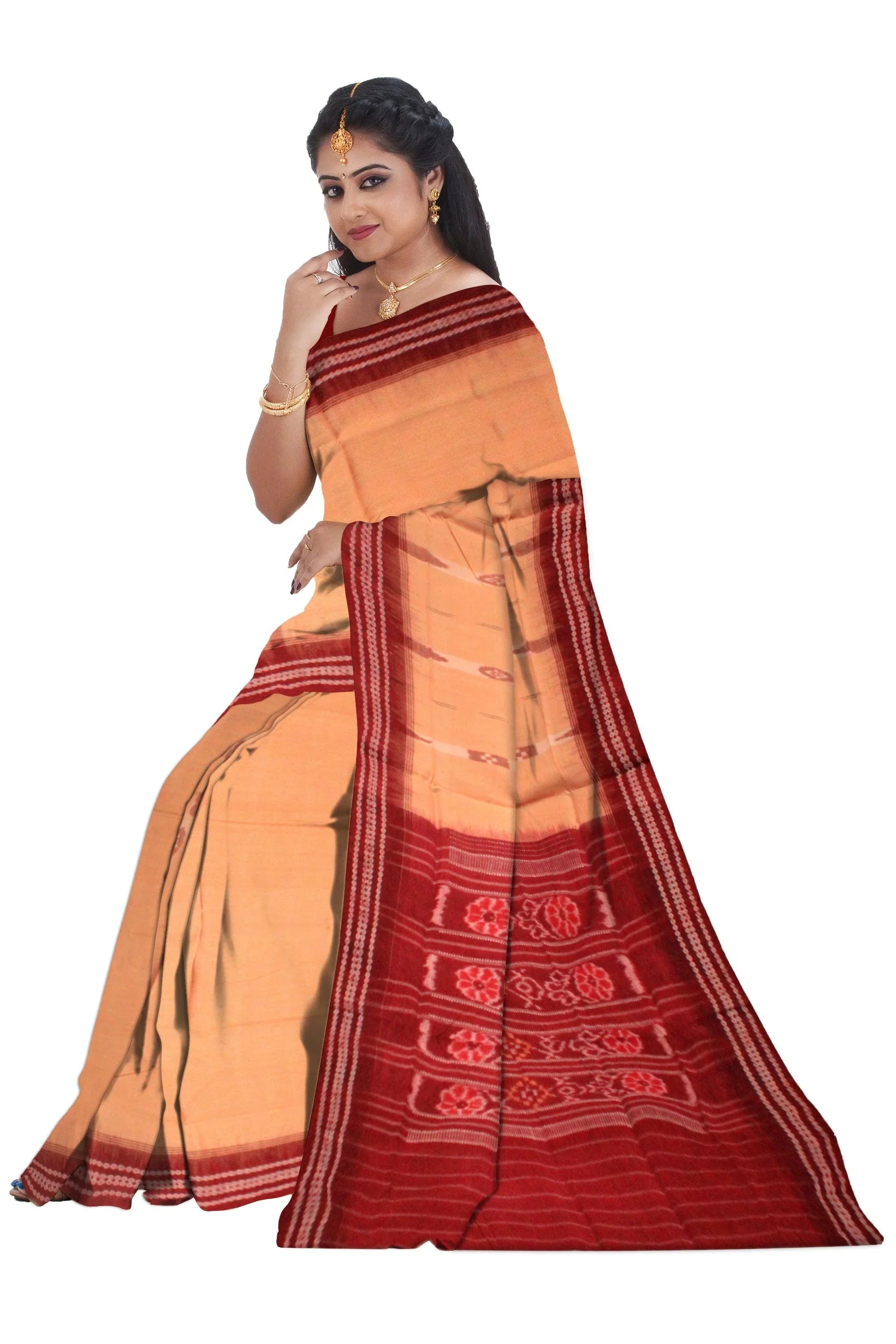 A sambalpuri cotton saree in light yellow color and coffee color base, with out blouse piece. - Koshali Arts & Crafts Enterprise
