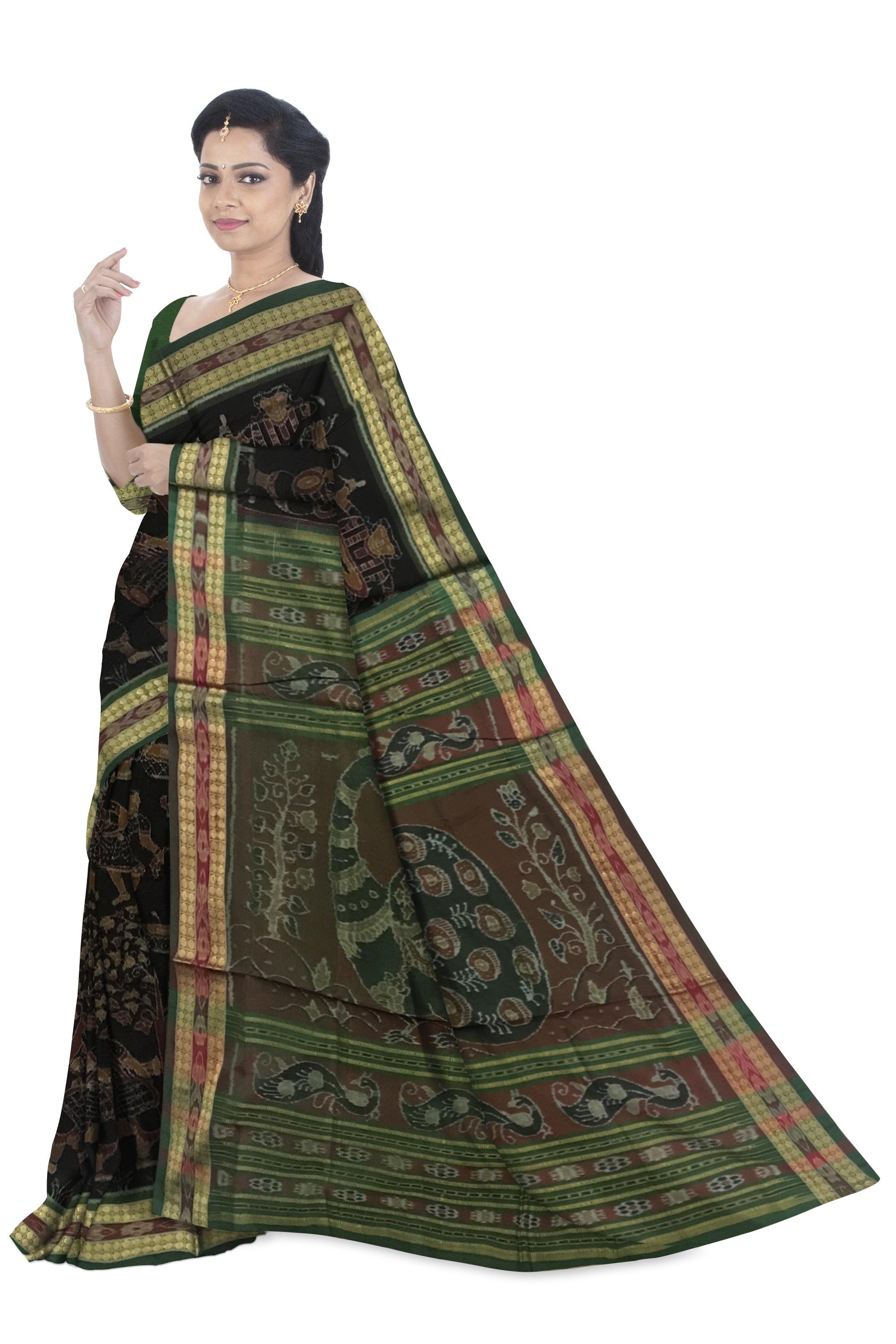 TRADITIONAL VILLAGE WITH NARTAKI AND MUSICALINSTRUMENT PATTERN SAMBALPURI COTTON SAREE IS BLACK AND GREEN COLOR BASE, WITH MATCHING BLOUSE PIECE. - Koshali Arts & Crafts Enterprise