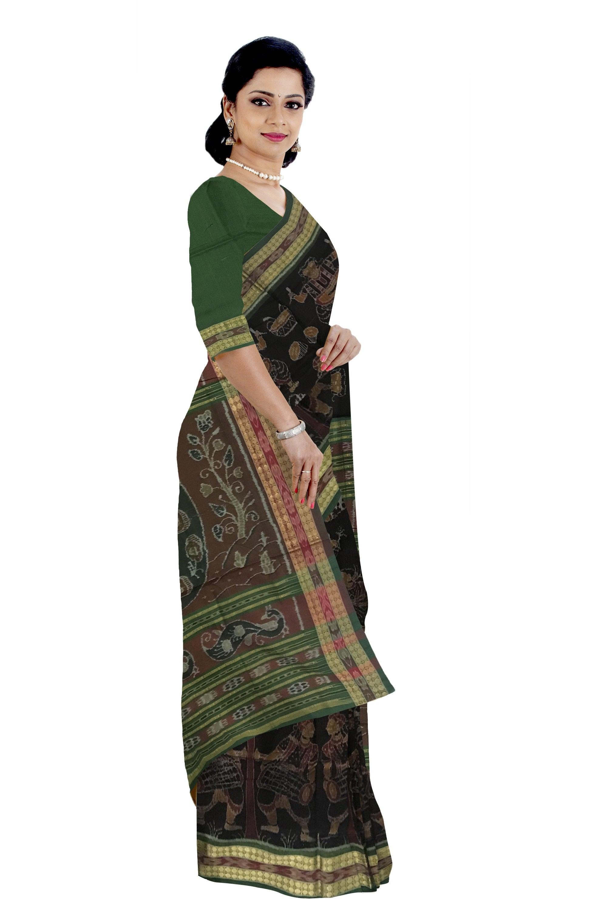 TRADITIONAL VILLAGE WITH NARTAKI AND MUSICALINSTRUMENT PATTERN SAMBALPURI COTTON SAREE IS BLACK AND GREEN COLOR BASE, WITH MATCHING BLOUSE PIECE. - Koshali Arts & Crafts Enterprise