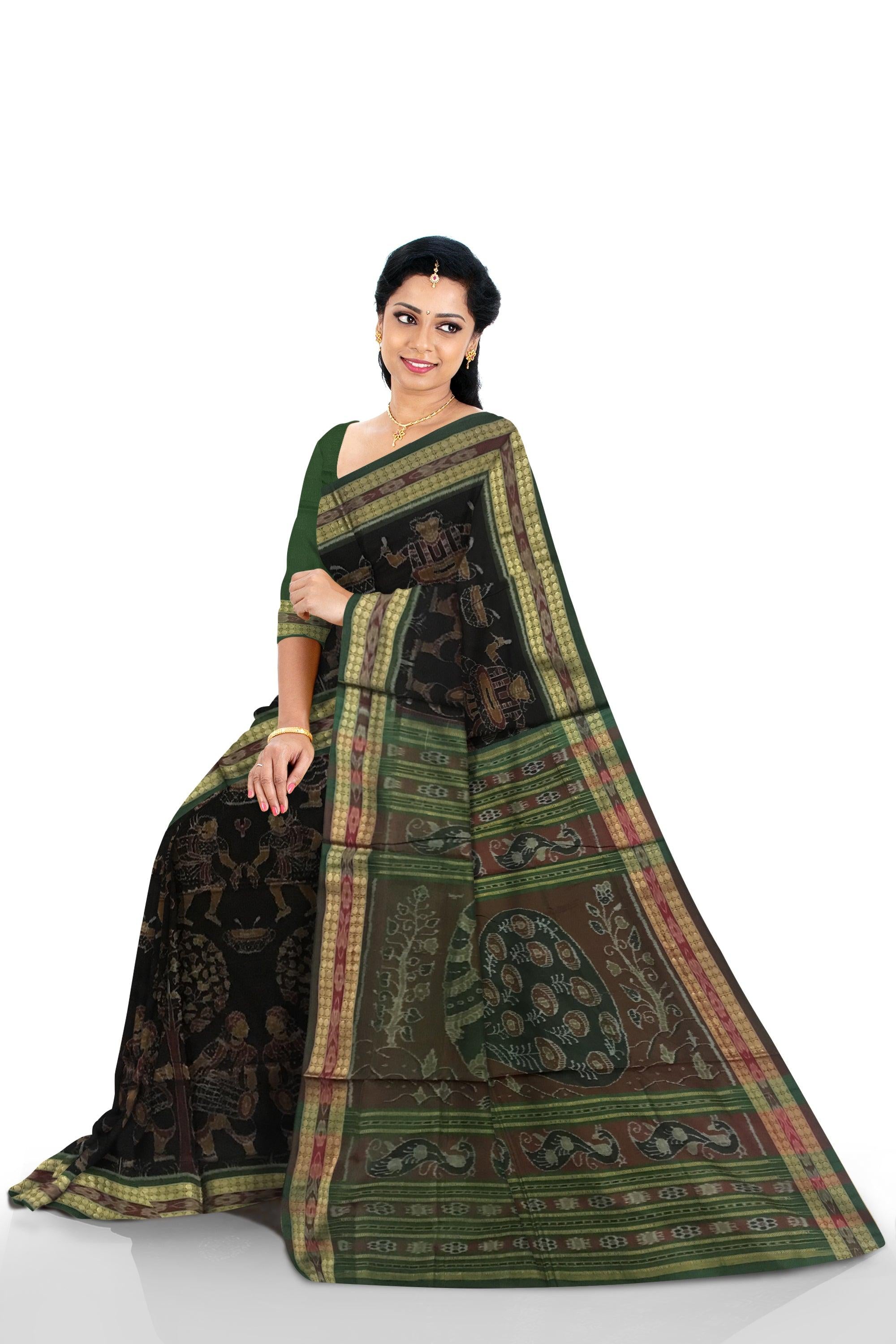TRADITIONAL VILLAGE WITH NARTAKI AND MUSICALINSTRUMENT PATTERN SAMBALPURI COTTON SAREE IS BLACK AND GREEN COLOR BASE, WITH MATCHING BLOUSE PIECE. - Koshali Arts & Crafts Enterprise
