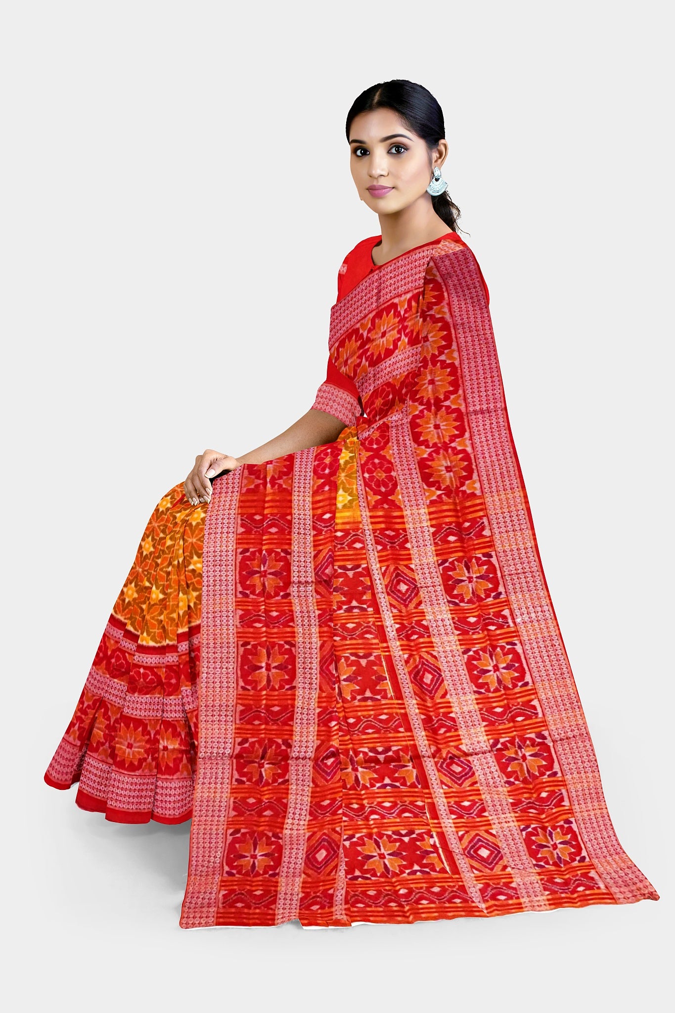Yellow-red Sambalpuri cotton saree with a body covered in many floral patterns and a pallu featuring a large flower design.