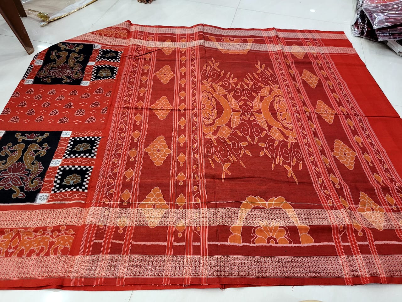 Latest Sambalpuri cotton saree features traditional pasapali with parrot design in vermilion and black, adorned with beautiful flower pallu. - Koshali Arts & Crafts Enterprise