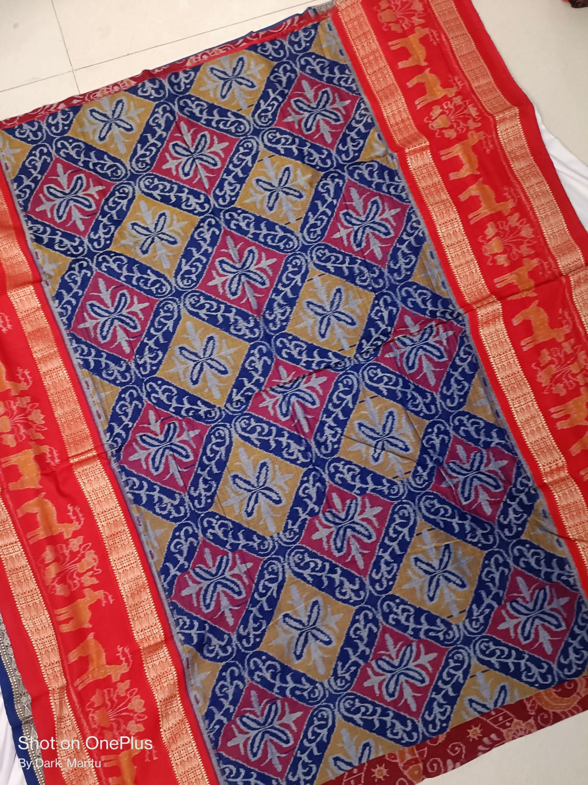 Blue & Red color Sambalpuri handloom cotton saree, complete with a matching blouse piece, epitomizes traditional elegance.
