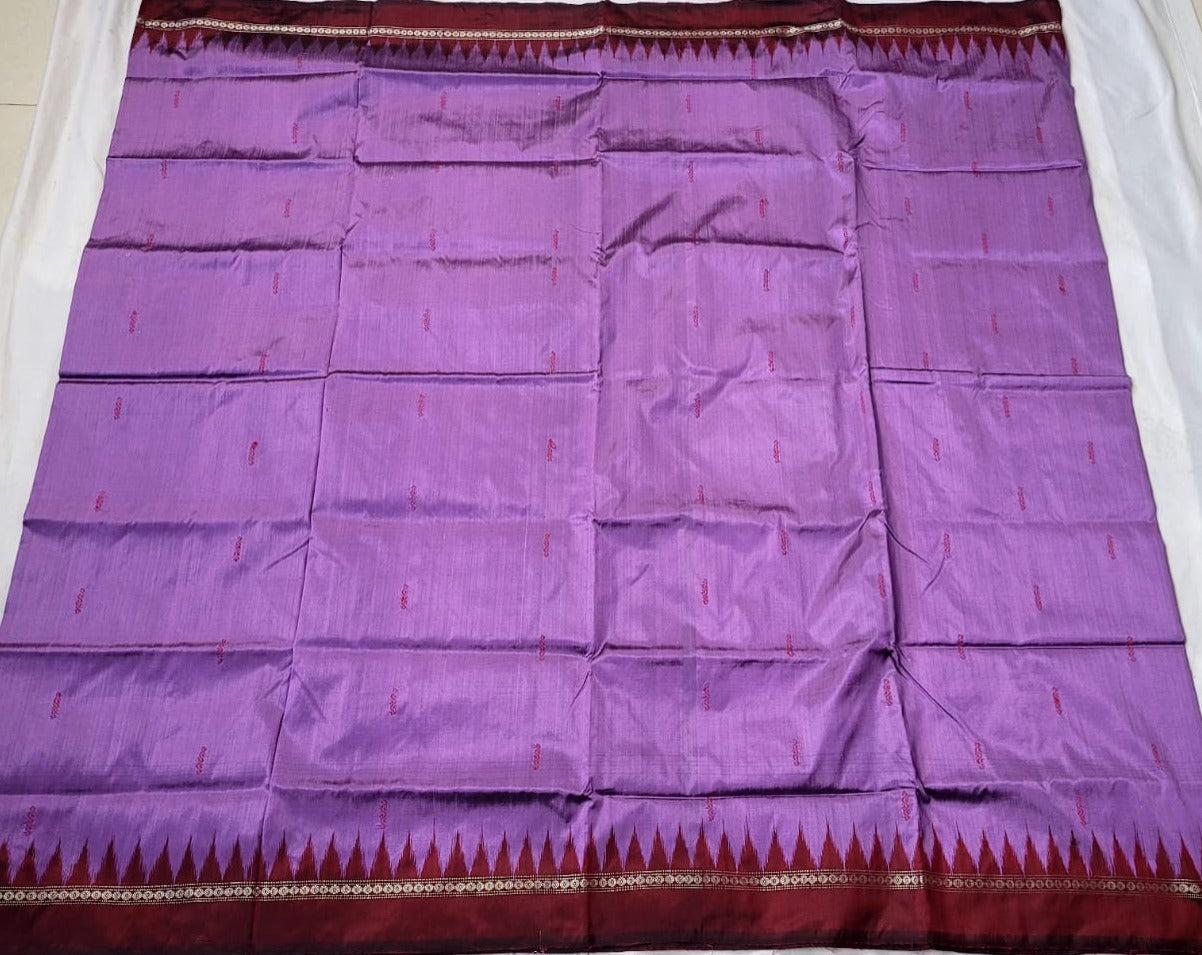 Purple and maroon silk saree with a plain body pattern, adorned with patli and flower designs on the pallu.