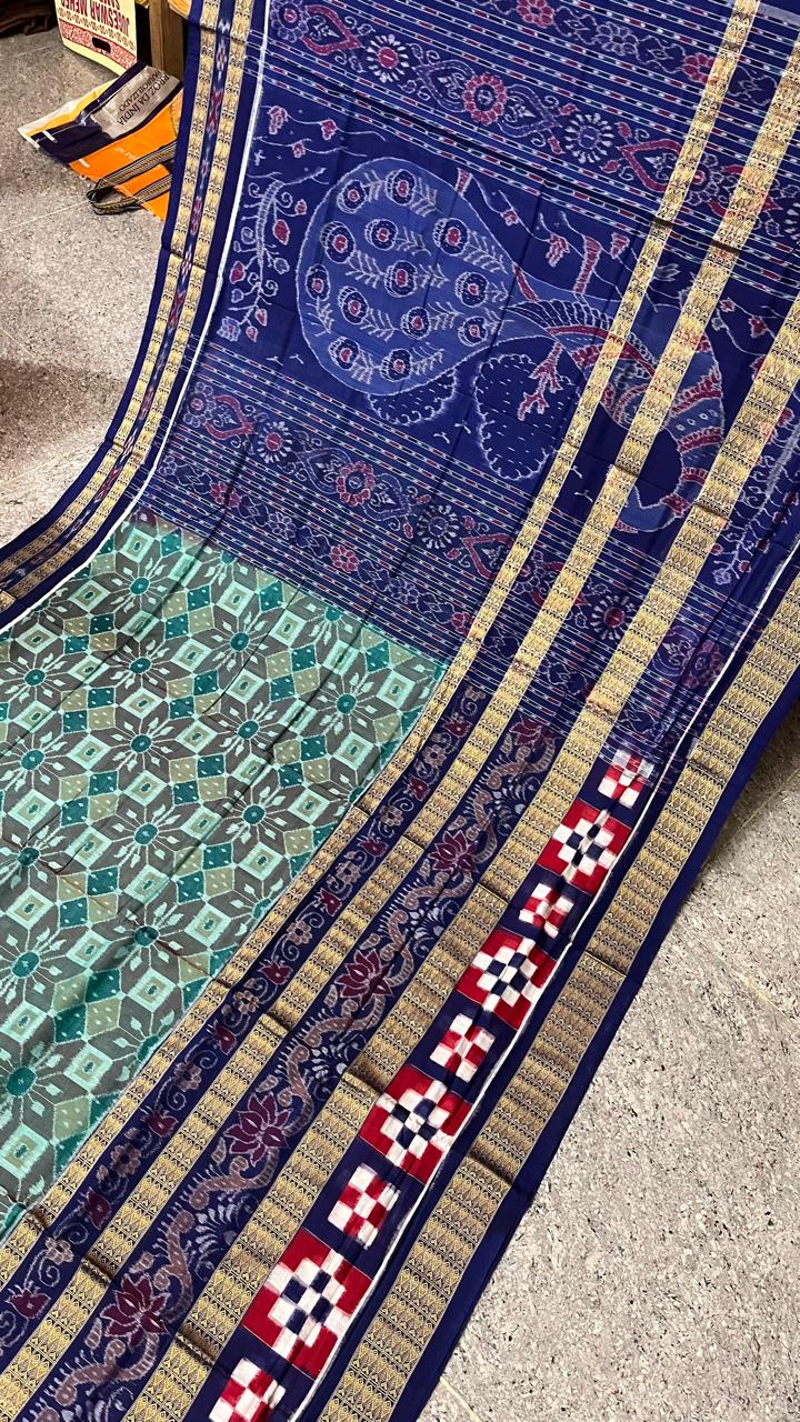 A stunning Sambalpuri cotton saree in sky and blue with a classic pasapali body design and floral patterns on the pallu.