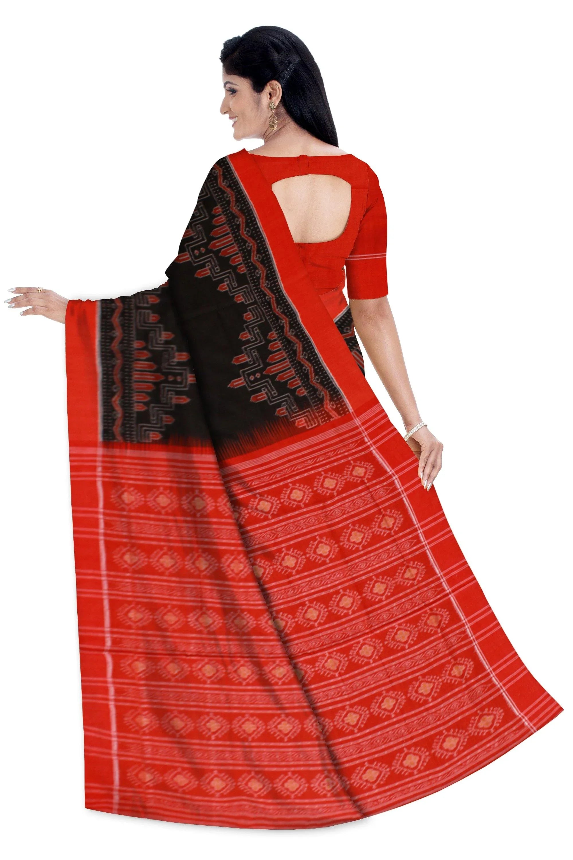 An authentic Sambalpuri Bandha Saree in black color and red pallu with blouse piece - Koshali Arts & Crafts Enterprise